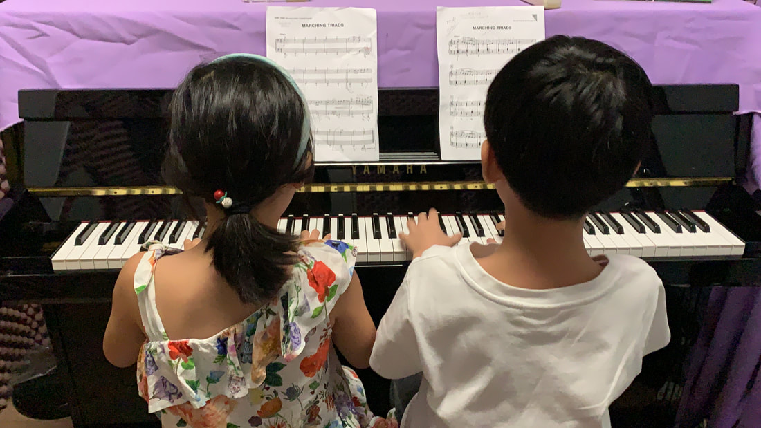 Young students playing a duet