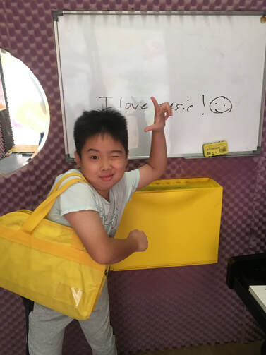 A happy young student — I love music!